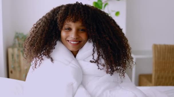 Cheerful Young Hispanic American Woman Covered Blanket Smiling Camera Bed — Video Stock