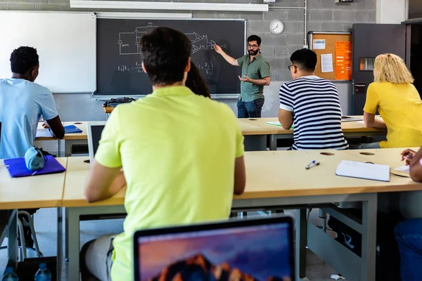 Young Adult Male Lecturer Teaching Technology Class Multiracial Young Students —  Fotos de Stock