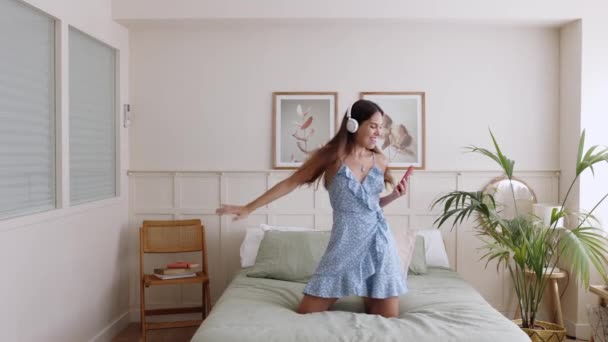 Young Woman Dancing Bed Bedroom While Listening Music Mobile Phone — Vídeos de Stock