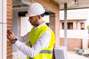 Smart civil architect engineer male inspecting indoor construction building site