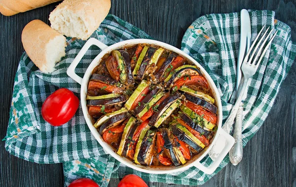 Ratatouille is a traditional French vegetable dish cooked in the oven. Diet vegetarian dish. Balanced nutrition. Eco food. Space for text.