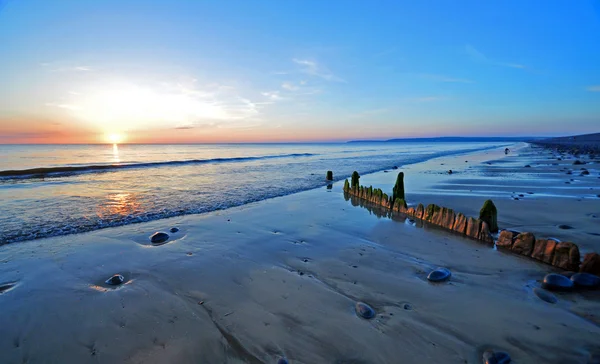 Puesta de sol en la playa Fotos de stock libres de derechos