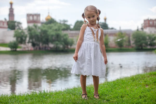 Beautiful shy girl walking outdoor near the lake — Stock Photo, Image