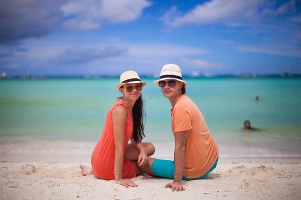 Young couple enjoying each other on a tropical beach and looking at camera — Stock Photo, Image