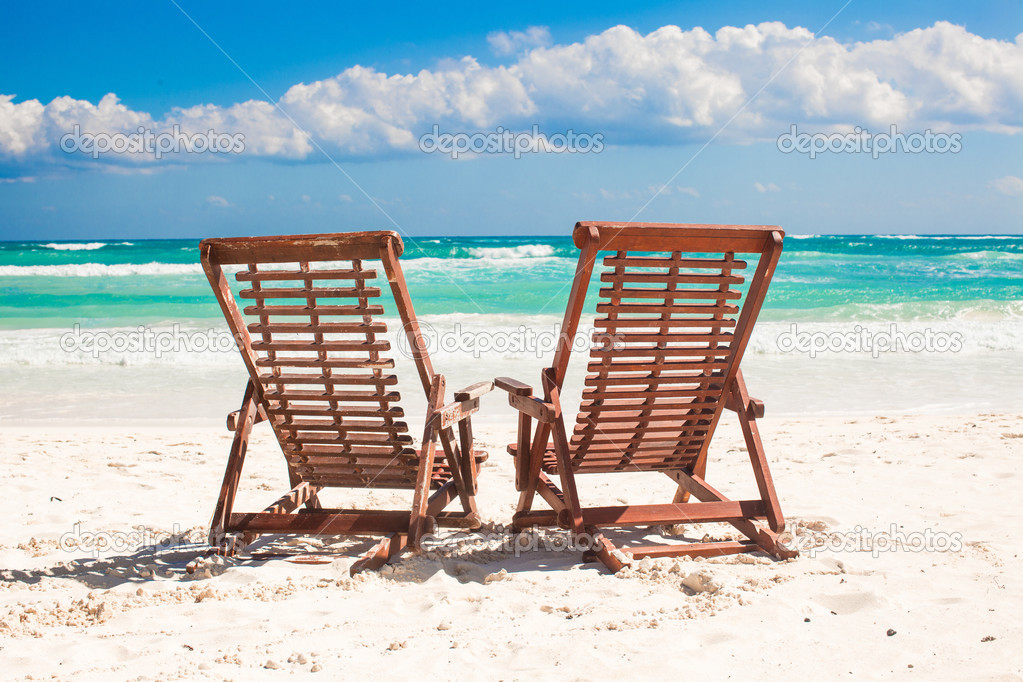 Beach Wooden Chairs For Vacations And Relax On Tropical White Sand Beach Wooden Chairs For Vacations And Relax On Tropical White Sand In Tulum Mexico Photo By D Travnikov