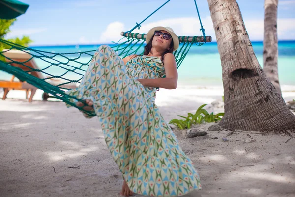 Happy young woman relaxing in the hammock on sunny day — Stock Photo, Image