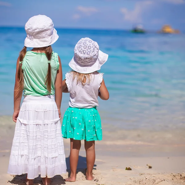 Little adorable girls in nice dress on white beach — Stock Photo, Image