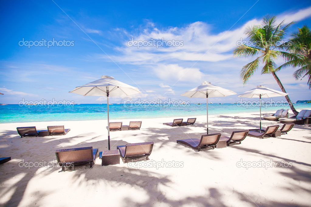 Beach wooden chairs for vacations and relax on tropical white sand plage
