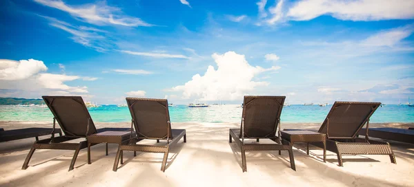 Beach chairs in exotic resort on perfect white sandy beach — Stock Photo, Image