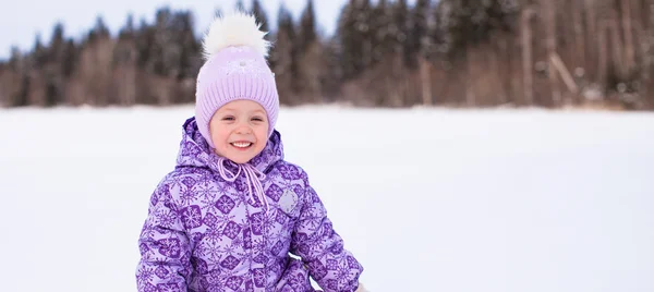 Little adorable girl enjoying snow winter sunny day — Stock Photo, Image