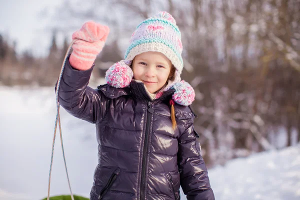 Little adorable happy girl enjoying snow sunny winter day — Stock Photo, Image