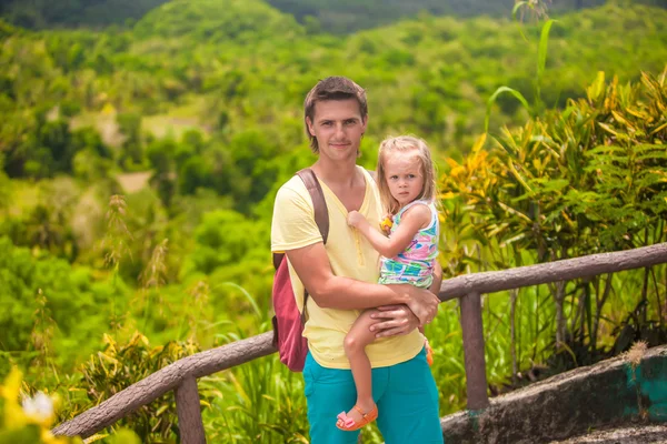 Dad with his daughter walking in tropical park at the Chocolate Hills — Stock Photo, Image