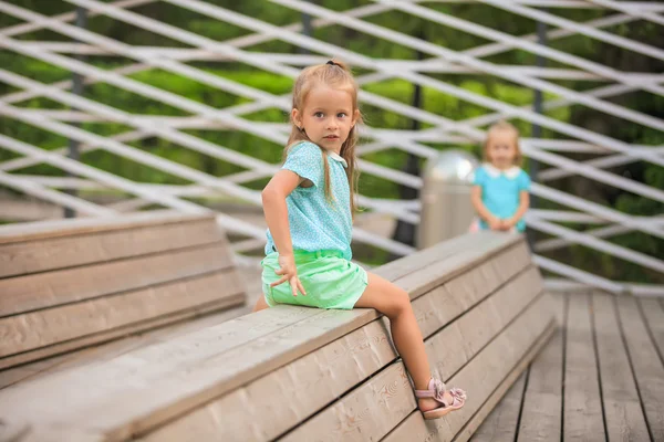 Adorable little girl walking outdoor and having fun in park — Stock Photo, Image