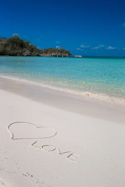 Love written on tropical beach white sand Royalty Free Stock Images