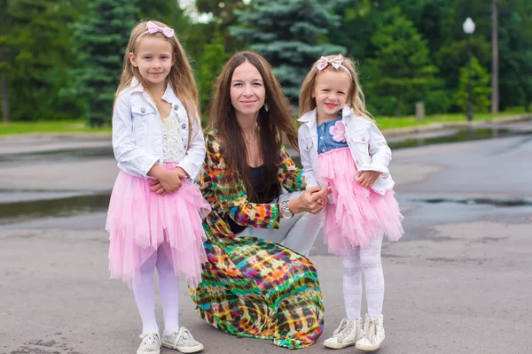 Happy mother and adorable girls enjoying warm day — Stock Photo, Image