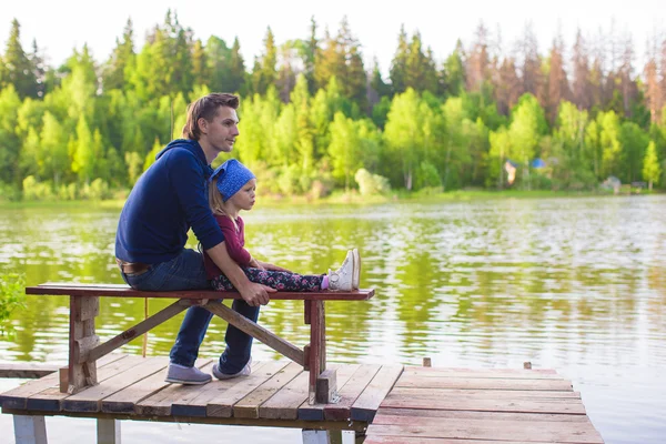 Young father and little adorable girl fishing on the river — Stock Photo, Image