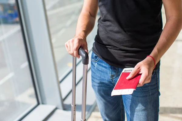 Handing over boarding pass and passport to embark on flight in an airport — Stock Photo, Image