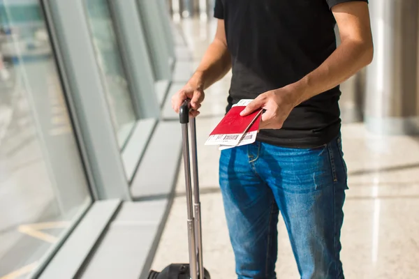 Handing over boarding pass and passport to embark on flight in an airport — Stock Photo, Image