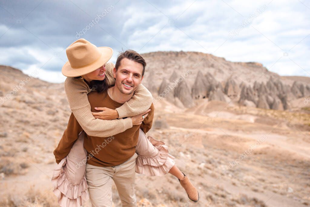 Happy couple on summer vacation in famous place. Cave formations.