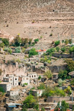 View of the old city with caves and air baloons in Cappadocia. Fabulous landscapes of the mountains of Cappadocia Goreme, Turkey