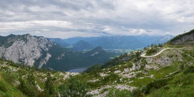 Panorama view from Loseralm restaurant viewpoint towards Altausseer lake, in the Ausseerland, Styria, Austria. No people, empty road, tourism, Summer.