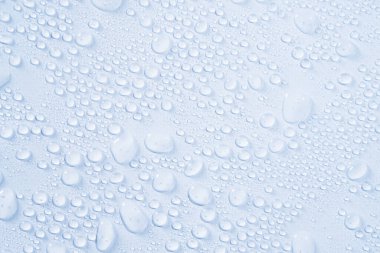 Cosmetics moisturizing liquid drops on a light white pastel background. Hyaluronic acid, toner or lotion
