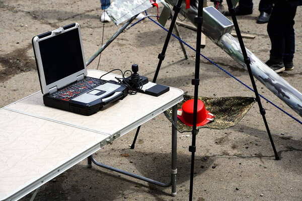 Military operator computer remote control of an unmanned aerial vehicle, defense and military industry. High quality photo