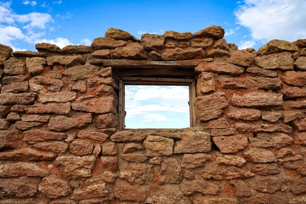 vintage wall with window wallpaper background blue sky with clouds. High quality photo