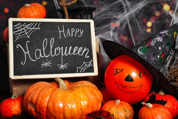 Happy Halloween. Orange scary pumpkins, spiders, spider webs and bats. Helloween is loading. High quality photo