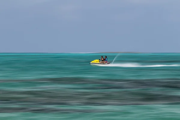 Mother and daughter riding a jet ski. — Stock Photo, Image