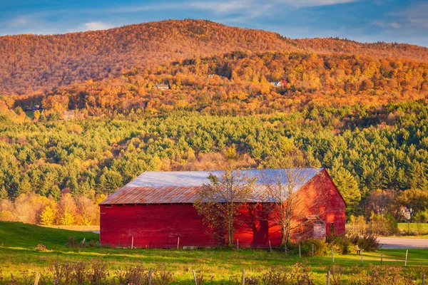 Red barn on a sunny fall afternoon, Stowe, Vermont, USA