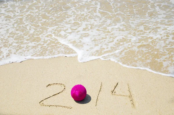 Number 2014 on the sand - holiday concept — Stock Photo, Image