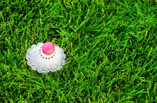 Shuttlecock on the grass — Stock Photo, Image
