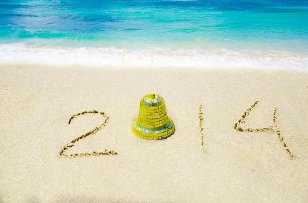 Number 2014 on sandy beach - holiday concept — Stock Photo, Image