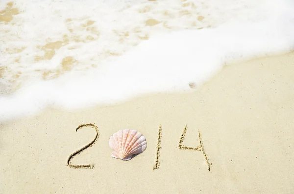 Number 2014 on sandy beach - holiday concept — Stock Photo, Image