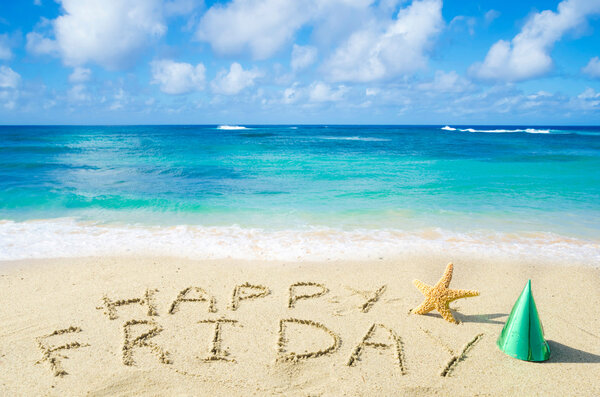 Sign "Happy Friday" on the sandy beach