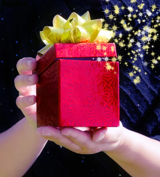 Gift box in woman's hands — Stock Photo, Image