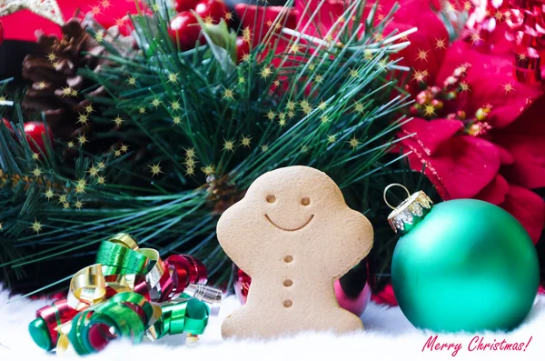 Gingerbread man with christmas ball — Stock Photo, Image