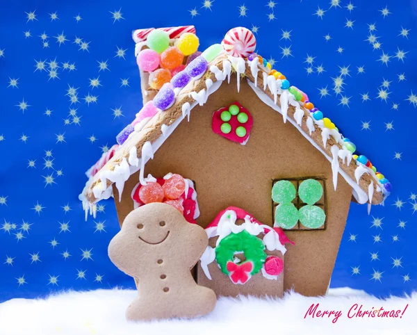 Gingerbread man by the house — Stock Photo, Image