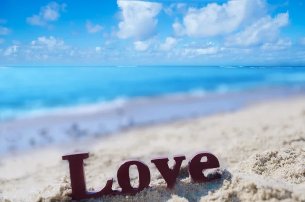 Sign "LOVE" on the beach — Stock Photo, Image