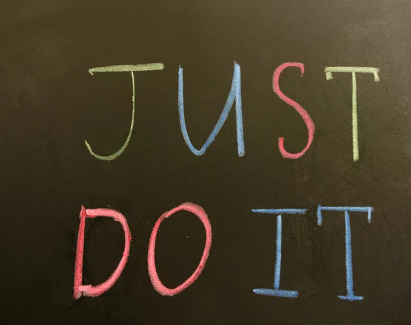 Sign "Just do it!" on the blackboard — Stock Photo, Image
