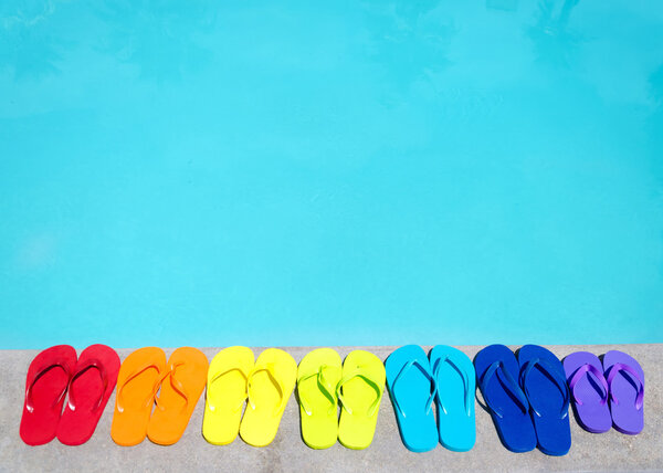 Color flip flops by the pool