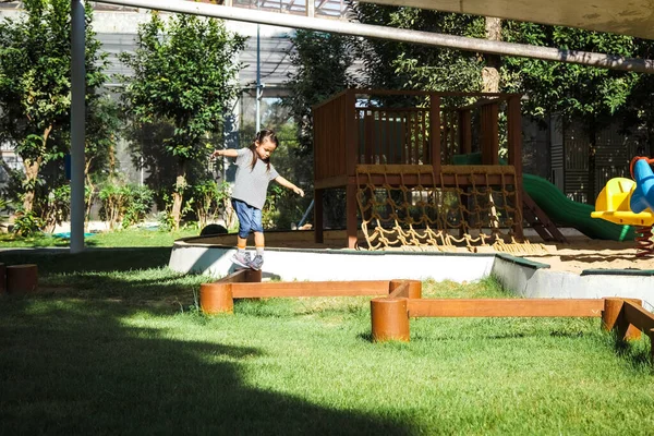 Active Little Girl Walking Balance Beam Outdoor Playground Park Happy — Stock Photo, Image