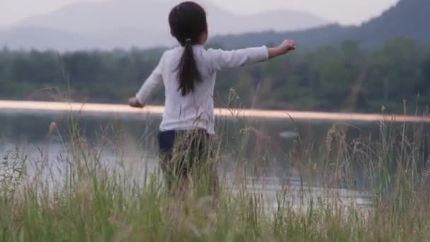 Rear View Cute Little Girl Raising Her Hand Jumping Summer — Video Stock