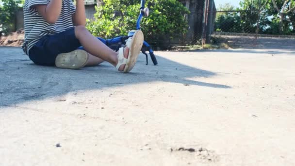 Sad Little Girl Sitting Ground Falling Her Bike Summer Park — Stock Video