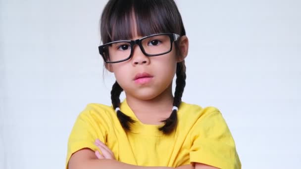 Upset Little Girl Glasses Stands Her Arms Crossed Looks Camera — Stock Video