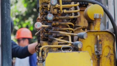 Engineering control crane hydraulic machine by hand. Close up of old levers for controlling mobile construction equipment. control crane truck