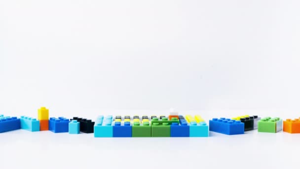 Stop Motion Animation Lego Houses Built Different Colored Blocks White — Vídeo de Stock