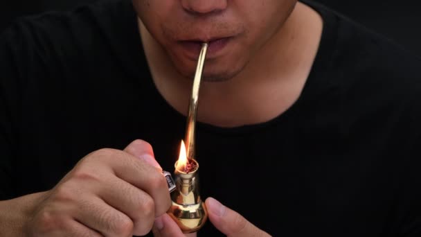 Asian Man Smokes Marijuana Pipe Home Studio Shoot Model Simulating — Vídeo de Stock