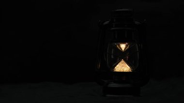 Vintage lamp on the table in the room. Retro lamp at night.